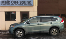 Green 2012 Honda CR-V with professional window tint in North Bay